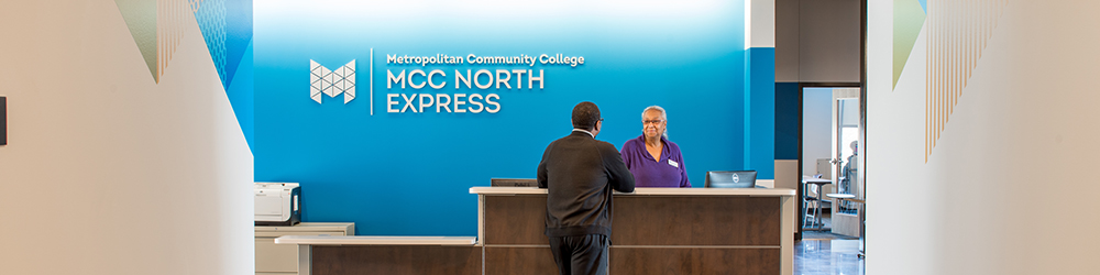 A student talks with a staff member MCC North Express