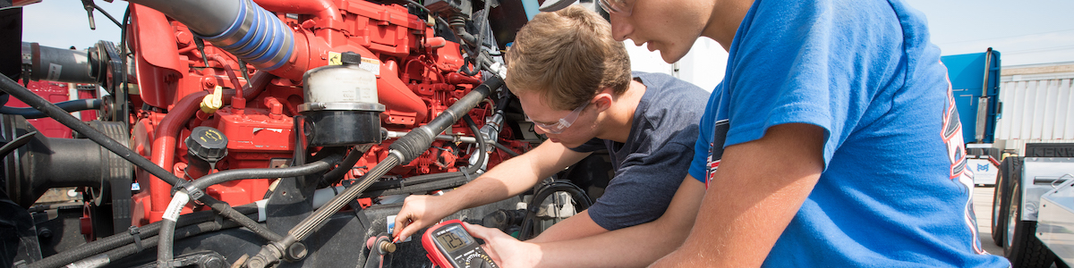 Diesel Technology Students working on a engine