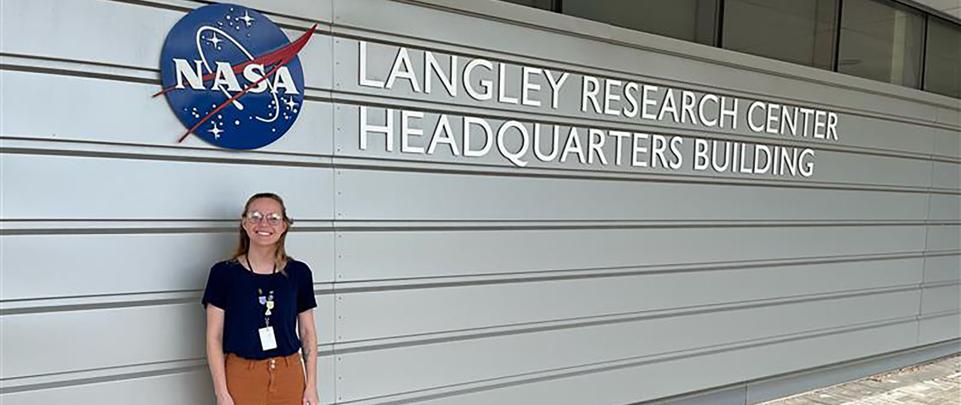 Claire Pape standing in front of NASA Langley Research Center